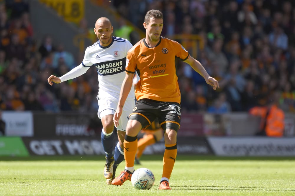 Middlesbrough striker Martin Braithwaite (10) holds up Wolverhampton Wanderers striker Leo Bonatini (33) 0-0 during the EFL Sky Bet Championship match between Wolverhampton Wanderers and Middlesbrough at Molineux, Wolverhampton, England on 5 August 2017. Photo by Alan Franklin.
