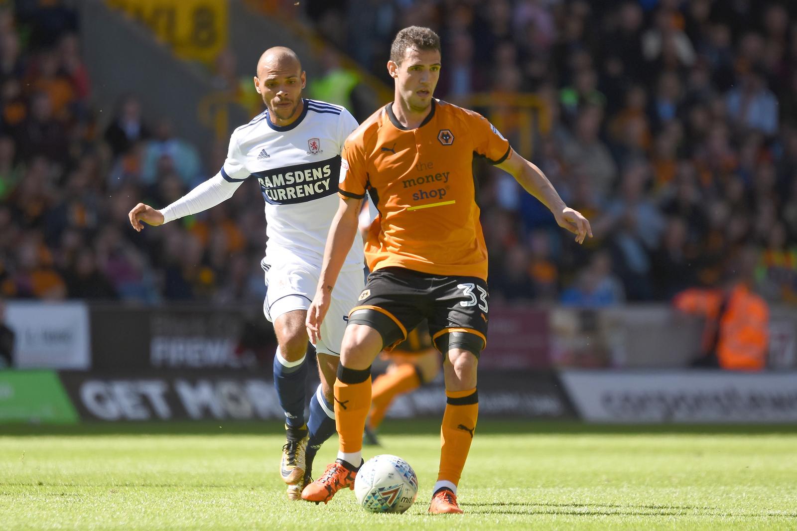 Middlesbrough striker Martin Braithwaite (10) holds up Wolverhampton Wanderers striker Leo Bonatini (33) 0-0 during the EFL Sky Bet Championship match between Wolverhampton Wanderers and Middlesbrough at Molineux, Wolverhampton, England on 5 August 2017. Photo by Alan Franklin.